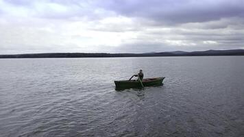 Enjoy the peaceful activity of kayaking on a serene lake, surrounded by natures tranquility. Stock Clip photo