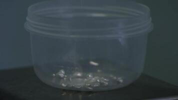 A clear plastic container on a table, sturdy and versatile for storage photo
