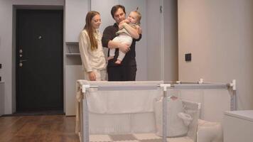 Mom and dad decided to put their daughter in the play pen and go to another room for a while, leaving her to play alone. video