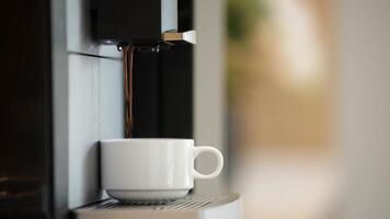 Close-up of preparing aromatic coffee in a professional coffee machine. Concept of modern technology, small business and coffee drinks. Pastel background. Free text space banner video