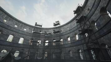 Renovation work in an ancient stone structure under a cloudy sky video