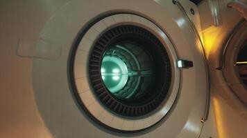 Interior view of a space station airlock with glowing core in orbit video