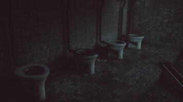 Dilapidated restroom with multiple toilets in an abandoned building video