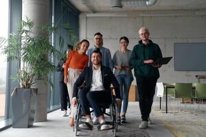 A diverse group of business professionals walking together through the office, symbolizing unity and strength as a collaborative and successful team photo