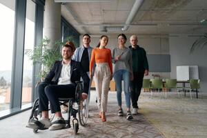 A diverse group of business professionals walking together through the office, symbolizing unity and strength as a collaborative and successful team photo