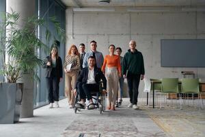 A diverse group of business professionals walking together through the office, symbolizing unity and strength as a collaborative and successful team photo