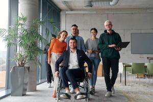 A diverse group of business professionals walking together through the office, symbolizing unity and strength as a collaborative and successful team photo
