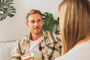 Portrait of handsome man and woman, attractive couple in love talking each other photo