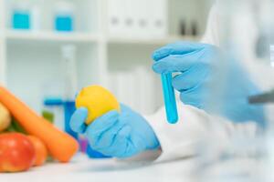 Scientist check chemical food residues in laboratory. Control experts inspect quality of vegetables vegetables. lab, hazards, find prohibited substances, contaminate, Microscope, Microbiologist photo