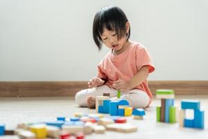 Happy Asia children play and learn toy blocks.family is happy and excited in the house. daughter having fun spending time, Activity, development, IQ, EQ, meditation, brain, muscles, essential skills. photo