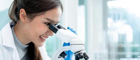 Scientist analyze biochemical samples in advanced scientific laboratory. Medical professional use microscope look microbiological developmental of viral. Biotechnology research in science lab. photo