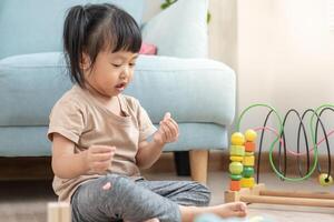 Happy Asia children play and learn toy blocks.family is happy and excited in the house. daughter having fun spending time, Activity, development, IQ, EQ, meditation, brain, muscles, essential skills. photo