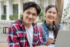 Group Asian student meeting team for work project. team happy study online. Read book in college campus. Group on international Asia University. Education, study, school, college, graduation photo