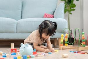 Happy Asia children play and learn toy blocks.family is happy and excited in the house. daughter having fun spending time, Activity, development, IQ, EQ, meditation, brain, muscles, essential skills. photo