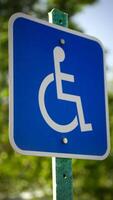 A blue sign with a white symbol on it photo