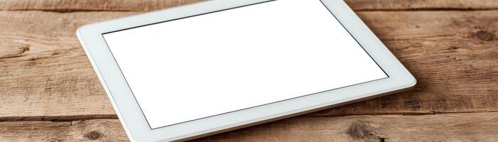 Modern tablet on wooden table, ideal for digital content creation and communication. photo