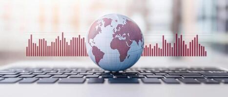 A global connection concept symbolized by a globe on a laptop, showcasing digital waves. photo