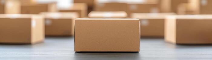 Close-up of a brown cardboard box amidst a blurred background of similar boxes. photo