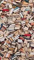 A beautiful collection of vintage books stacked in various orientations and colors. photo