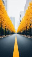 A serene urban road lined with vibrant autumn trees and a clear sky. photo