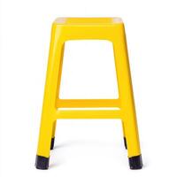 Bright yellow stool perfect for modern interiors and playful spaces. isolated on white background. photo