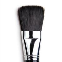 A close-up of a professional makeup brush with soft bristles. isolated on white background. photo