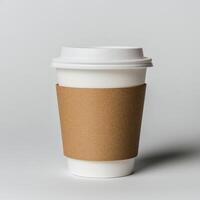 Stylish coffee cup with a kraft paper sleeve on a minimal backdrop. photo