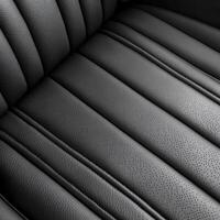 Close-up view of a sleek, modern black leather car seat. photo