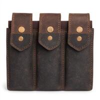 Stylish leather tool pouch with three compartments and metal studs. isolated on white background. photo