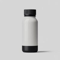 Minimalistic gray drink bottle with black lid on a plain background. isolated on white background. photo