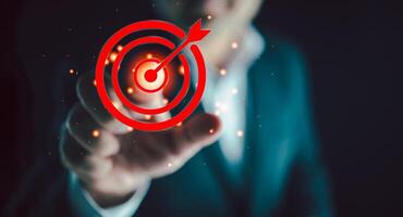 Businessman with a target in front of his. Business strategy action plan. photo