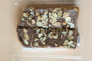 Slices of toast bread with chocolate cream and nuts photo