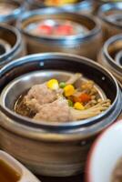 Mix dim sum chinese food in bamboo basket photo