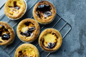 Egg tart dessert served on rack photo