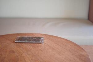 broken smart phone on a table photo