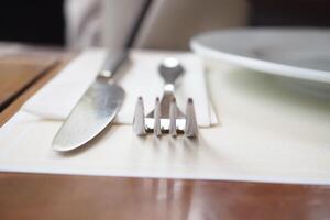 An Elegant Table Setting Featuring a Fork and Knife for Dining That Exudes Sophistication photo