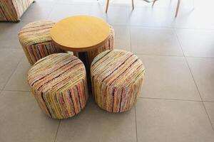 Colorful Round Stools and Table in Modern Interior Setting photo