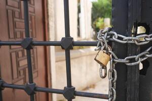 A Secured Gate featuring a Padlock and Chain for enhanced protection and safety measures photo
