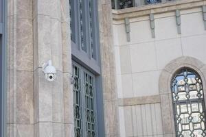 Security Camera Successfully Mounted on the Wall for Optimal Surveillance Purpose and Use photo