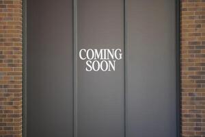Highquality Coming Soon Sign Announcement on Dark Background for an Upcoming Event photo