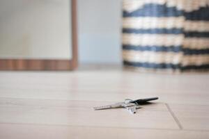 house keys on the ring on table in a room. To forget keys at home concept , photo