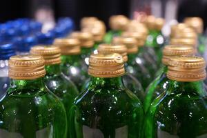 Close-up of Bottled Juices in Refrigerator Display, Brightly Lit in Grocery Store photo