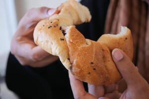 Enjoy Deliciously Freshly Baked Bread with Flavorful Nutty Black Seeds at Your Breakfast Table photo