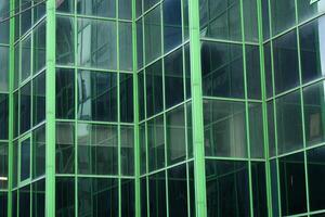 A Modern Green Glass Building Facade Featuring Striking and Intricate Geometric Patterns photo