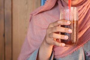 Indulging in a Refreshing Drink While Relaxing in a Cozy and Comfortable Setting photo