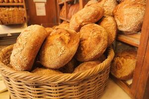 A Warm and Freshly Baked Artisan Bread Presented in a Charming Rustic Bakery Basket photo