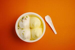Indulge in a delightful serving of Delicious Vanilla and Pistachio Ice Cream in a Cup photo