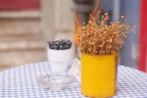 Charming Caf Table Decor with Dried Flowers and Decorative Pots photo