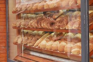A Beautiful Array of Freshly Baked Breads Displayed Temptingly in a Bakery Window photo