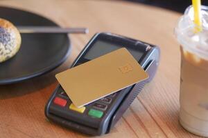 contactless payment concept with young man paying with credit card photo